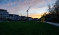 Leuven, Flemish Brabant Region, Belgium - Real estate development with contemporary apartment blocks during a colorful sunset