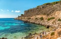 Visitors enjoying the Cala Fredda beach during their trip on the Levanzo island in the Mediterranean sea of Sicily. Royalty Free Stock Photo