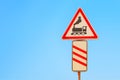 Level crossing warning sign on blue sky background. Railway transportation safety symbol Royalty Free Stock Photo