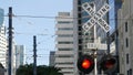 Level crossing warning signal in USA. Crossbuck notice and red traffic light on rail road intersection in California. Railway Royalty Free Stock Photo