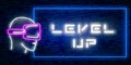 Level Up Neon Text Vector With Brick Wall Background. design template modern trend design night neon signboard night bright Royalty Free Stock Photo