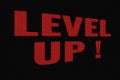 Level UP red word on dark screen