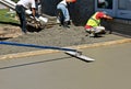 Long handled bull float levels wet concrete Royalty Free Stock Photo