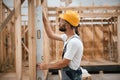 Leveling device. Industrial worker in wooden warehouse Royalty Free Stock Photo