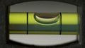 Leveling instrument`s bubble closeup. Carpenter`s spirit level macro. Buildings and construction level Royalty Free Stock Photo