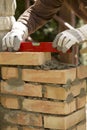 Leveling the masonry bricks Royalty Free Stock Photo