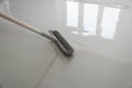 Self-leveling epoxy. Leveling with a mixture of cement floors with a roller