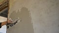 leveling the wall with a layer of plaster next to the doorway Royalty Free Stock Photo