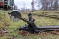 Lever on narrow gauge railway tracks. An old roundhouse in central europe