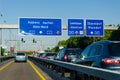 Leverkusen, Germany - July 26, 2019: Road traffic on the German Highway autobahn A1 with road signs and traffic light. Cars ride