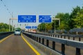 Leverkusen, Germany - July 26, 2019: Road traffic on the German Highway autobahn A1 with road signs and traffic light. Cars ride