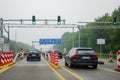 Leverkusen, Germany - July 28, 2019: Road traffic on the German Highway autobahn A1 with road signs and traffic light. Cars ride