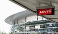 The Levis logo on the ceiling in front of a store in an outlet in Wolfsburg, Germany, June 15, 2018 Royalty Free Stock Photo