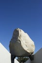 Levitated Mass Over Walkway While Visitors Engage by Walking Under Royalty Free Stock Photo