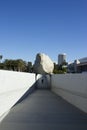 Levitated Mass Over Walkway While Visitors Engage by Walking Under Royalty Free Stock Photo