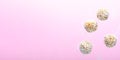 Levitating Coconut Vegan Sweets, Delicious Candy Balls, Healthy Candies on Pink Background Royalty Free Stock Photo