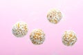 Levitating Coconut Vegan Sweets, Delicious Candy Balls, Healthy Candies on Pink Background Royalty Free Stock Photo