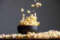 Levitating falling popcorn in a ceramic cup and around it.