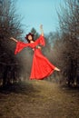 Levitating girl among the trees. Royalty Free Stock Photo