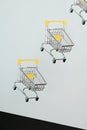 Levitating shopping carts on blue background. Safe online shopping on quarantine concept. Flying Empty supermarket