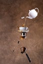 Levitation coffee and tea splashes on brown background Royalty Free Stock Photo