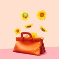 Levitation concept. Sunflower head flowers flying, falling and levitating over a very old natural color leather female handbag.