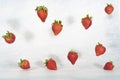 Levitation effect, falling strawberries on light background