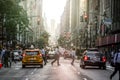 Lexington Crowdy Avenue in Manhattan at around 5PM on a Red Light Intersection. 5PM with Sunset in the Background on a Red Light