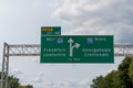 Sign for left Exit 118 for I64 West toward Frankfort and Lousiville