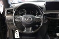 Lexus LX 570 III steering wheel and dashboard. Black leather interior of the SUV. The modern interior of a premium SUV.