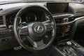 Lexus LX 570 III steering wheel and dashboard. Black leather interior of the SUV. The modern interior of a premium SUV.