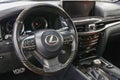 Lexus LX 570 III steering wheel and dashboard. Black leather interior of the SUV. The modern interior of a premium SUV.