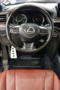 Lexus LX 570 III steering wheel and dashboard. Black leather interior of the SUV. The modern interior of a premium SUV.