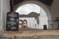A leyend in spanish language about happines and beer writing in a black barrel