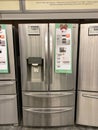 A LG stainless steel french door refrigerator on sale at a Home Depot Store