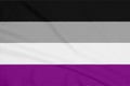 LGBT asexual community flag on a textured fabric. Pride symbol