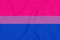 LGBT Bisexual pride community flag on a textured fabric. Pride symbol