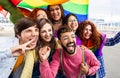 LGBT community people with rainbow flag celebrating gay pride day festival Royalty Free Stock Photo