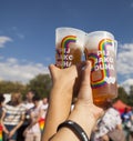 LGBT couple holding drinks