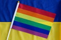 LGBT flag against the background the flag of Ukraine. LGBT Pride Month. LGBTQIA