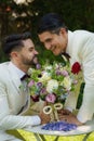 Lgbt gay bride and groom with flower bouquet in wedding ceremony Royalty Free Stock Photo