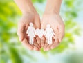 Female hands holding paper gay couple pictogram