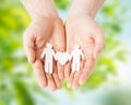 Male hands holding paper gay couple pictogram