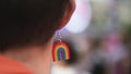 Lgbt gay pride concept. Rainbow earring jewelry close up. Lgbtq symbol closeup.