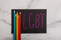 LGBT initailization lesbian gay bi sexual transgender sign with rainbow colored art pencils Royalty Free Stock Photo