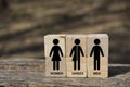 Symbol of people who identify themselves with different sexual preferences, which is used to identify a bathroom, in wooden cubes Royalty Free Stock Photo