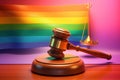 LGBT Law gay marriage. Judge gavel on rainbow color flag top view banner. Transgender rights copy space