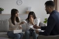 LGBT lesbian couple consulting phychologist. Middle eastern woman crying, her gay partner comforting her