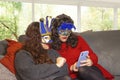 LGBT Lesbian couple girlfriends during pandemic carnival having video-call