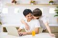 gay man kiss his partner working on laptop Royalty Free Stock Photo